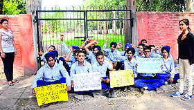 Students of Government Model Senior Secondary School, Sector 35, Chandigarh, protest outside the campus on Saturday.
