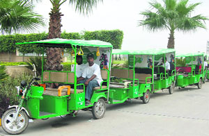 A fleet of battery operated autorickshaws which have been incorporated by a telecom firm to sell mobile connections and recharges in Amritsar. 