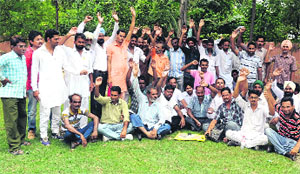 Contract employees of the BSNL stage protest against the Central government at childrens park in Bathinda on Sunday.