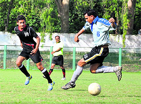 Players in action during the Nemidas Memorial District Football League at Pavilion Ground in Dehradun on Sunday