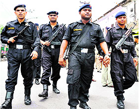 Elite Commandos of the Guldaar strike force lead a flag march taken out in Haridwar on Sunday in view of communal violence in Saharanpur.