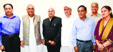 Chief Minister Bhupinder Singh Hooda and Chief Secretary SC Choudhary (second from right) with newly appointed commissioners (from left) Sarban Singh, Shiv Raman Gaur, Dr Amar Singh, Sunil Katyal and Rekha Rani in Chandigarh on Sunday