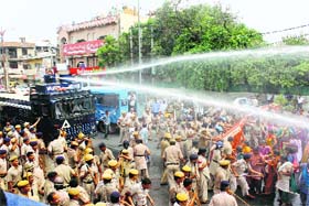 Brute force: The police use a water cannon to disperse health workers in Rohtak on Sunday