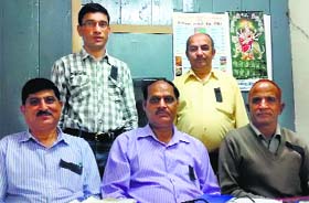 Revenue staff wear black badges against the government notification in Dalhousie on Saturday