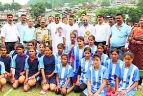 Social Justice and Empowerment Minister Dhani Ram Shandil with players after declaring the Minjar sports open in Chamba on Sunday