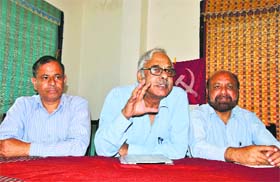 Rajya Sabha member Tapan Sen addresses a press conference in Mandi on Sunday