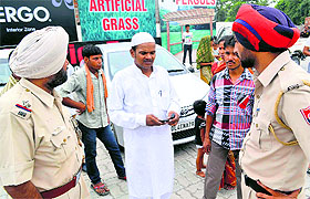 Relatives of the youth, Sahshad, narrate the drowning incident to the police personnel in Ludhiana on Sunday; and (right) the victim.