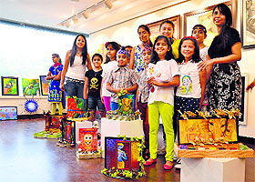 Children, who attended a summer camp at Artistry Studio, showcase their creations. 