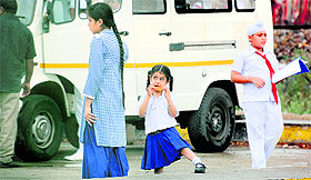 A girl relishes ice-cream after spending a day in a school in Ludhiana.