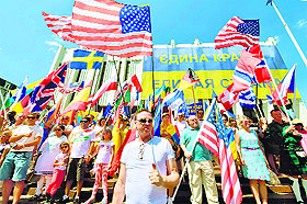  Foreigners working and living in Ukraine carry flags of their countries during a rally in Kiev on Sunday. 