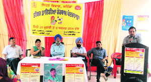 Dr Satish Jindal addresses a gathering during a function organised at Women & Children Hospital to observe World Hepatitis Day in Bathinda on Monday.