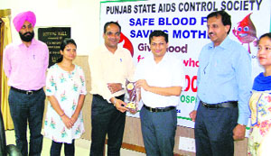 Mansa Deputy Commissioner Parveen Kumar Thind honours blood donors on World Blood Donors Day on Monday.