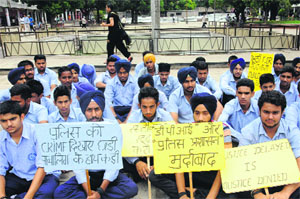 One of the rusticated students and his classmates protest at the Sector 17 Plaza in Chandigarh on Monday.