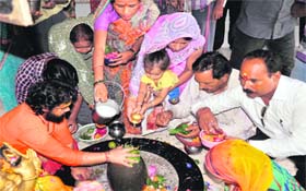 Call of faith: Devotees offer Ganga jal and milk at the Shri Bilkeshwar Mahadev temple, Haridwar, on the third Monday of Saawan