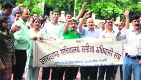 Review officers hold a demonstration in support of their demands in Dehradun on Monday