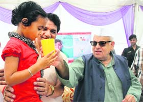 Governor Aziz Qureshi administers a medicine as part of a diarrhoea prevention campaign at Doon Womens Hosiptal on Monday