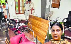 Damaged school furniture after a principal and a teacher thrashed each other in Karnal on Monday. Manisha Kamboj (inset), the teacher who came late to the school, is the wife of an HJC leader. Tribune photo