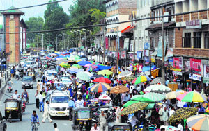 People shop ahead of Eid-ul-Fitr in Srinagar on Monday.