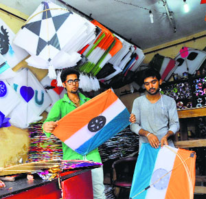 Boys buy kites at a shop in the Pacca Danga market in Jammu.
