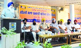 A speaker addresses a gathering during a convention of the Sehkari Sabhavan Karamchari Union Punjab at Punjabi Bhawan in Ludhiana