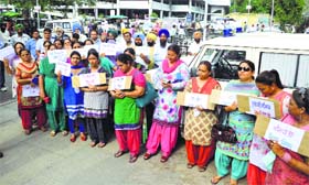 Teachers hold a protest in front of the DEO office in Ludhiana on Monday