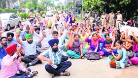 ETT teachers hold a protest near Chatar Singh Park in Ludhiana on Monday