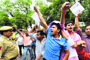 Students protest against introduction of CSAT in Civil Services exams outside the UPSC office in New Delhi on Monday