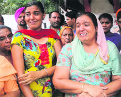 Grieving relatives of Manoj Kumar who is missing since May 25, in Faridkot on Monday