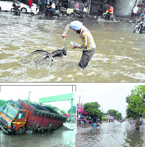 (Clockwise from top) A man tries to get a grip of his bicycle near the Ludhiana railway station; an area inundated in Phagwara; and a truck whose tyres sunk into a road following a heavy rain in Ludhiana on Monday.
