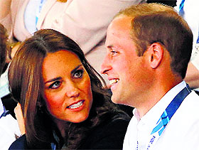 royal attendance: Catherine, the Duchess of Cambridge, sits with her husband Prince William as they watch artistic gymnastics in Glasgow on Monday.