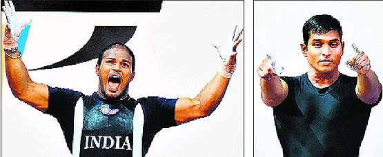 Gold medallist S Sivalingam and silver medallist Ravi Katulu celebrate after making their medal-winning lifts.