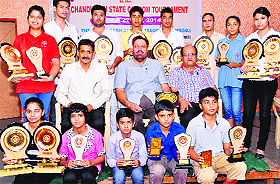 Winners pose with trophies in Sector 45, Chandigarh, on Tuesday.