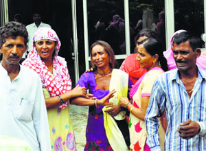 Relatives of the deceased woman outside the Kalpana Chawla Government Medical College Hospital in Karnal on Tuesday.