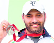 Harpreet Singh with his medal.