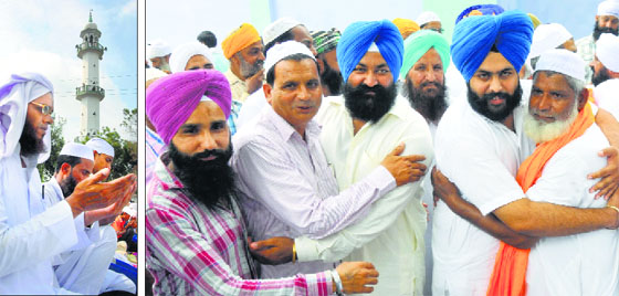 With Uttar Pardeshs Saharanpur town simmering with Muslim-Sikh tension, members of the two communities greeting each other on Eid-ul-Fitr in Karnal makes for a good click, while a man (left) offers prayers in Gurgaon.