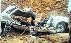 The mangled remains of the ill-fated car that got buried under the debris at Jassor village near Kangra on Tuesday. Tribune photograph