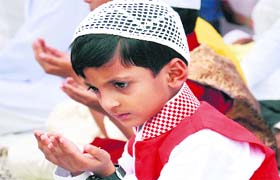 Pious moments: A child offer prayers on the occasion of Eid-ul-Fitr at a mosque in Jalandhar on Tuesday