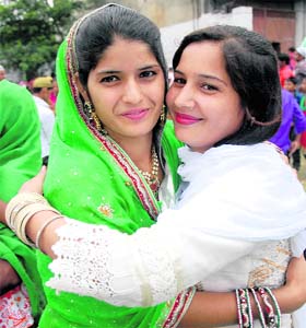 A gesture of love: Girls embrace each other after offering prayers on the occasion of Eid-ul-Fitr at a mosque in Jalandhar on Tuesday