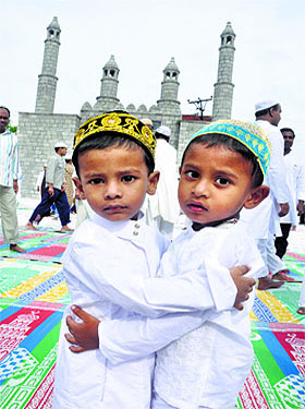 children greet each other after the prayers in Jammu. Eid-ul-Fitr marks the end of the holy month of Ramadan.