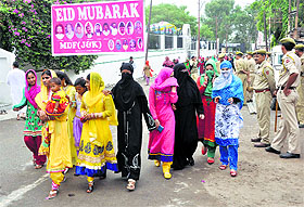 Muslim women come out of an Eidgah after offering prayers on Eid-ul-Fitr in Jammu.