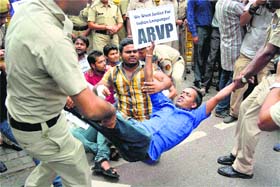 Protest on: Policemen detain ABVP members who were protesting against the C-SAT in New Delhi on Tuesday