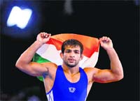 Amit Kumar after winning gold in the 57kg category. PTI