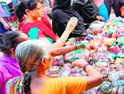 Women buy bangles on Hartalika Teej in Haridwar on Tuesday.