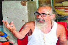 Matra Sadan Ashram founder Swami Shivanand discusses quarrying on the Ganga river bed at Jagjeetpur in Haridwar on Tuesday.