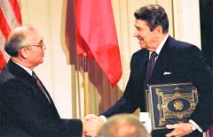 US President Ronald Reagan (R) with Soviet leader Mikhail Gorbachev after signing the Intermediate Range Nuclear Forces Treaty to eliminate intermediate-range missiles, in Washington in this December 8, 1987. AP/PTI