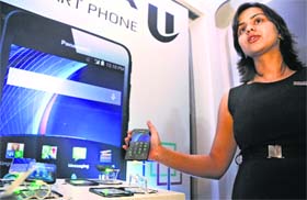 A model displays Panasonic Eluga U smartphone at its launch in New Delhi on Wednesday