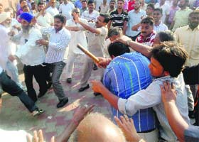Two groups clash over the illegal sale of a shop near Ram Lila ground in Dera Bassi on Wednesday