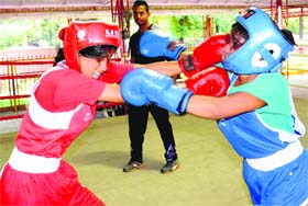 Blow for a blow: Girls exchange punches during an inter-school boxing championship in Chandigarh on Wednesday