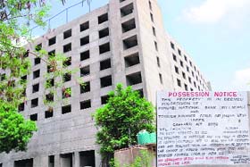 A notice put up by Punjab National Bank on the property of Joy Hotel and Resorts in the Industrial Area, Phase II, Chandigarh, on Wednesday