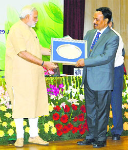 Prime Minister Narendra Modi confers the Sardar Patel Outstanding ICAR Institution Award upon NDRI Director AK Srivastava on the 86th Foundation Day function held in Delhi on Tuesday.
